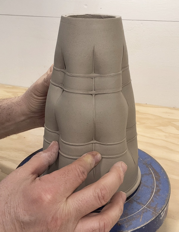 9 Press the form further at the intersections to emphasize a tufted appearance.