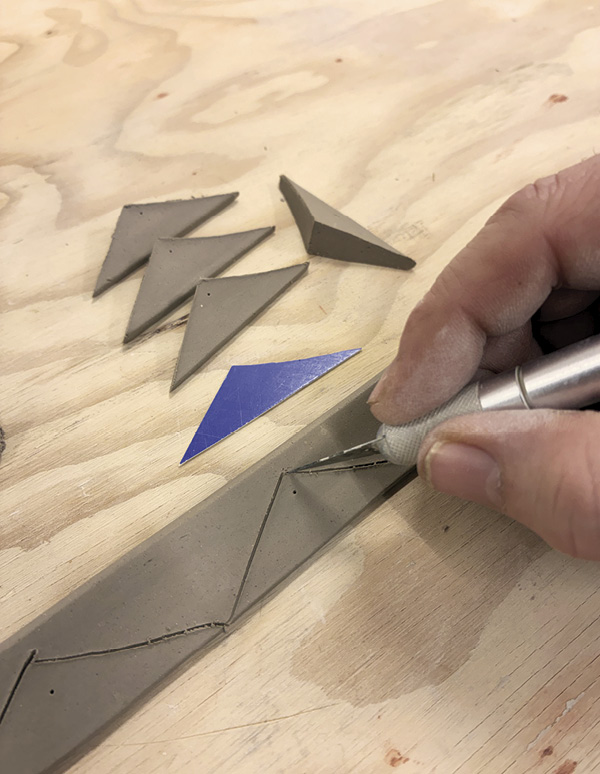 13 Make buttresses by flattening thick coils into a triangular shape.