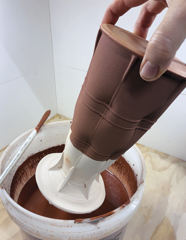 18 Apply a resist, then dip the vase in a thin slip made for wood firing.