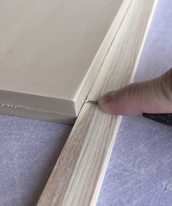 2 Lay a thickness strip or wooden shim next to the slab and use a needle tool to mark the horizontal and vertical guides.
