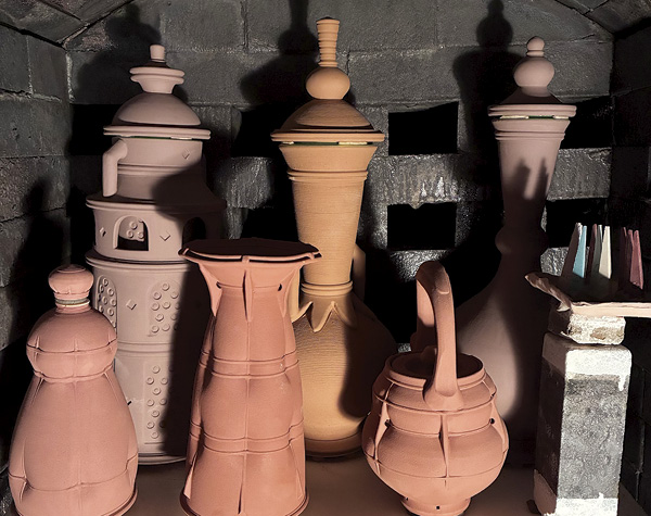 6 Ted Neal’s pre-fire kiln load with a selection of vase forms.