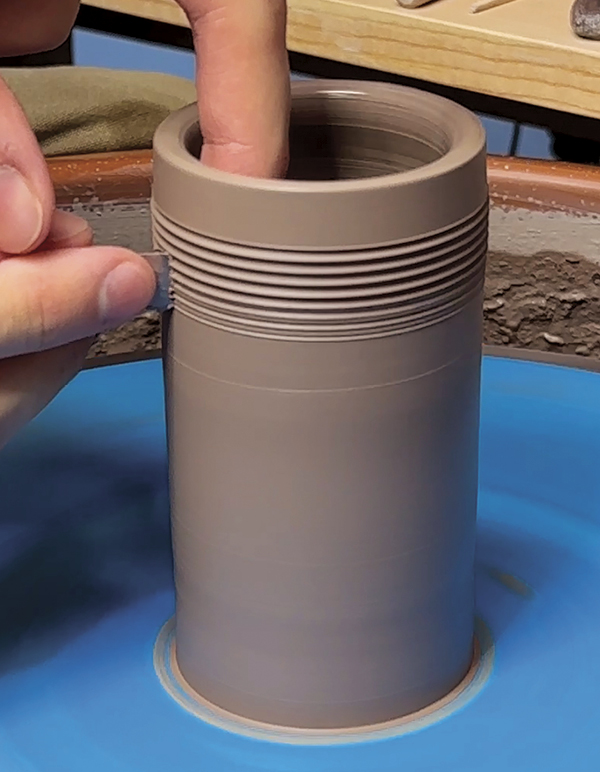 2 Throw a slightly larger tall and thin cylinder and smooth the surface.