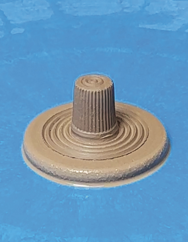 5 Throw a small disk and attach a finial to the top. Add grooves.
