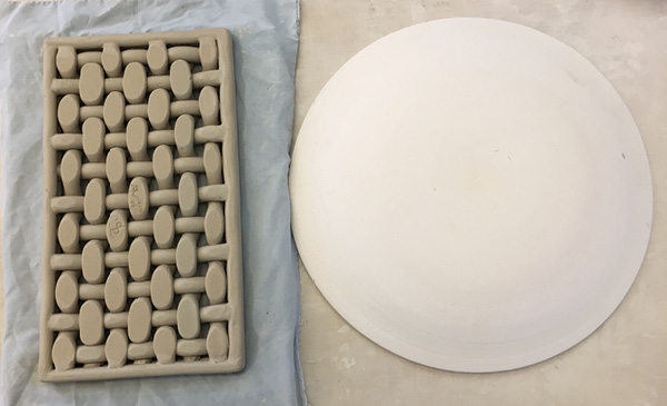 11 Gently flip the plate over and finish attaching and refining all of the joints on the underside. Lift the form onto the mold and adjust it for uniformity over the curve.