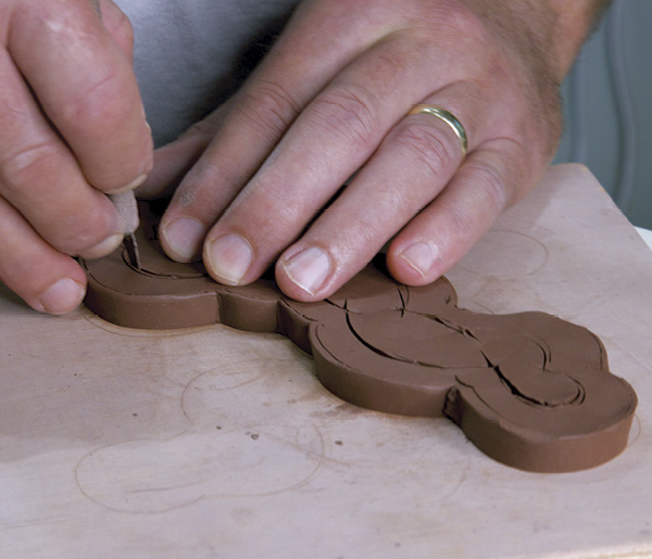 6 Trace the base of the joined candelabra top onto a slab, then cut out the interior for a foot ring.