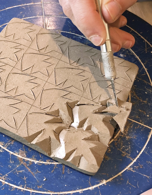 6 Remove the pieces of clay with the tip of the X-Acto knife.