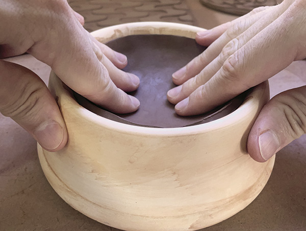 6 Press the circles into a slump mold or bowl. These will be the top and bottom pieces.