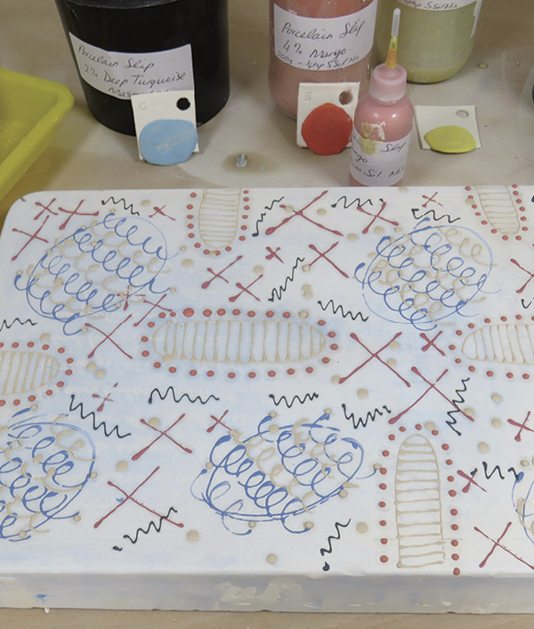 6 Fill the plaster surface with pattern and mark making before moving on to the painted background.