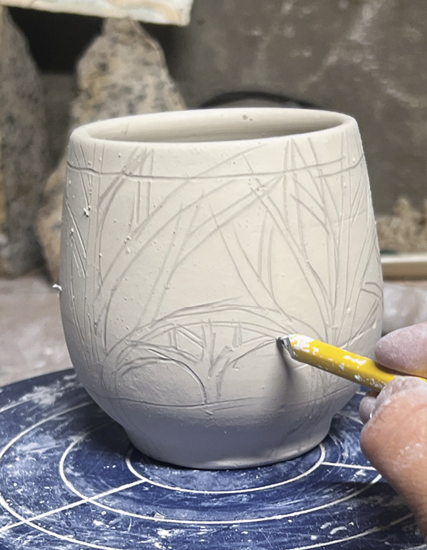 3 Use a dull pencil to draw larger trees, then fill in spaces with smaller trees.