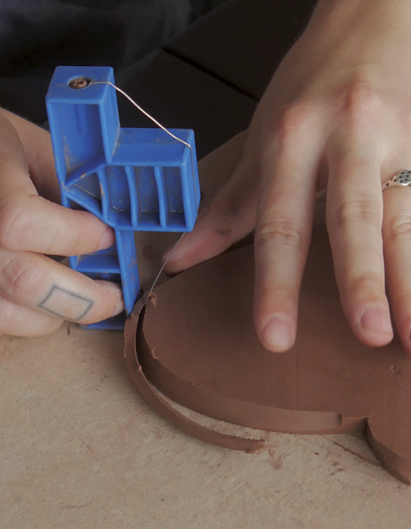 3 Bevel the edges with the long side of a bevel cutter to create a 60-degree cut.