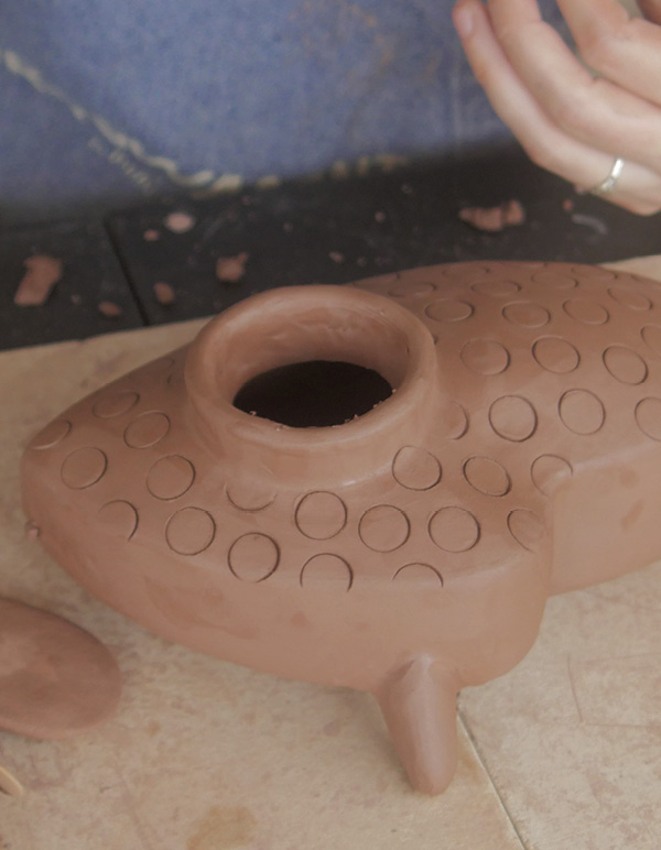 15 Cut open the space inside the rim then poke holes in each foot.