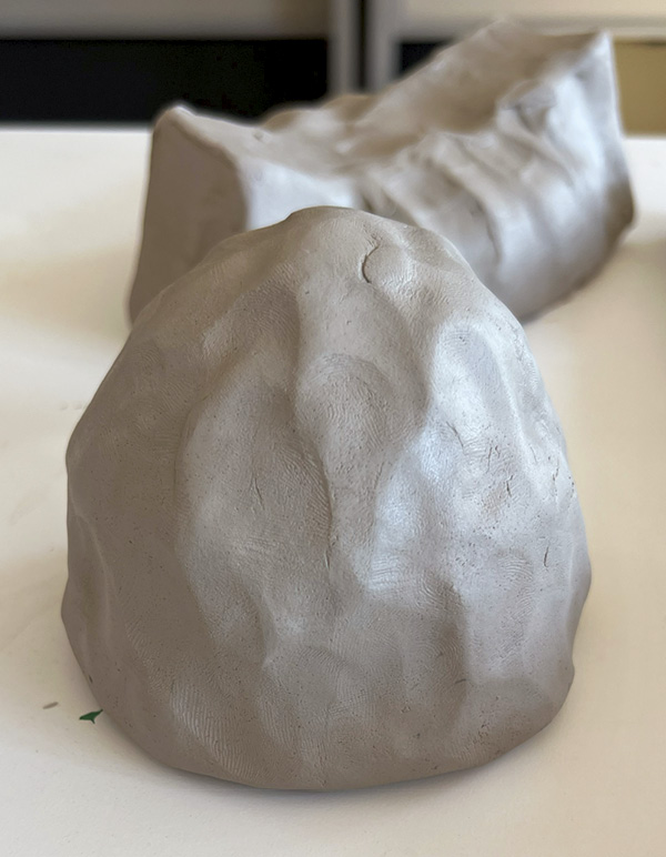 4 Pinch and refine further as the clay begins to dry and become more firm.