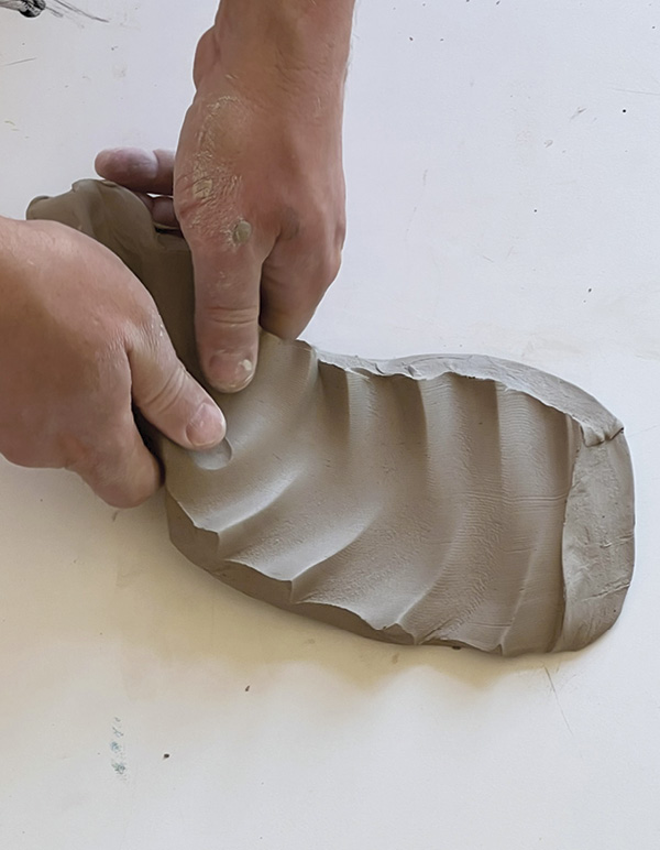 8 Slap the cut slab onto the table to create interesting distortions.