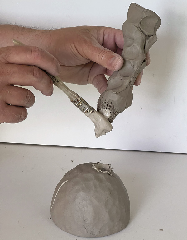 14 Dab slip onto the scored surfaces so they can come together like a zipper.