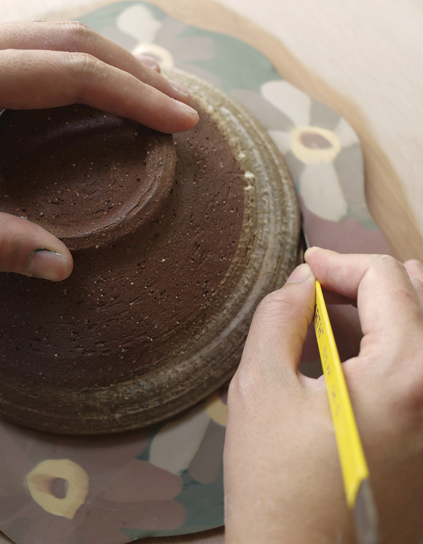 7 Place a round shape in the center and cut out a circle for the mirror opening.