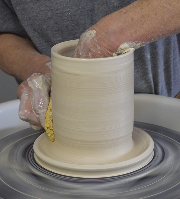 2 Pull the wall into a tall, straight cylinder.