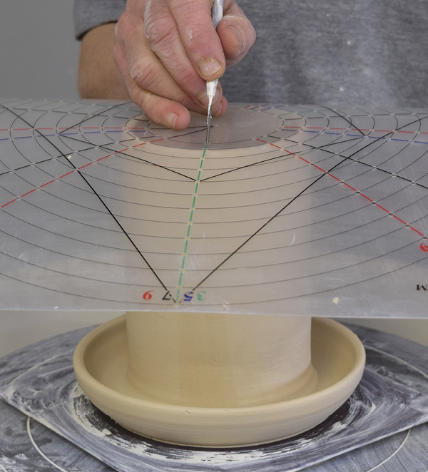 11 Remove the lid and mark three equally spaced spots on the feeder.