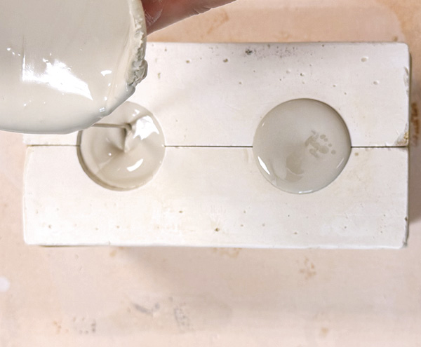 1 Pour the porcelain casting slip (or your choice of casting slip) into the ornament mold.
