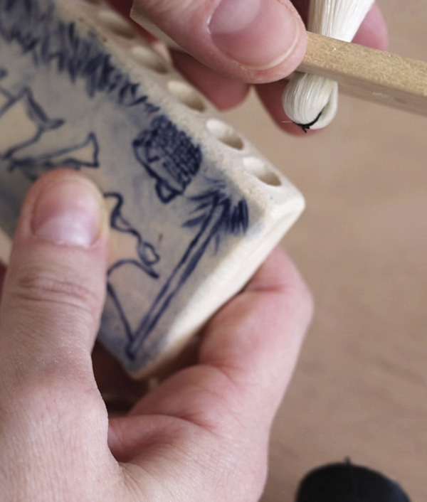 15 Add glue to each hole and insert the bundles.
