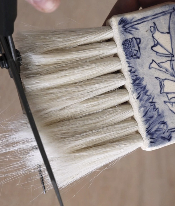 18 Once the glue has cured, use scissors to trim and shape the bristles.