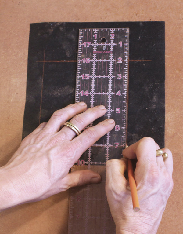1 Using a ruler, colored pencil, and scrap of tar paper, draw a 5-in. (12.7-cm) square.