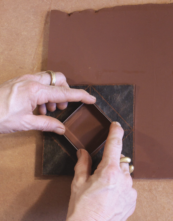 3 Using a knife or square cookie cutter, cut out a slab for frame face and interior.