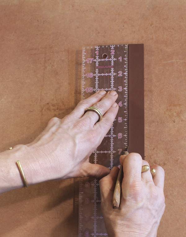 4 Cut four 1-in. (2.5 cm)-wide strips of clay at least 5½ in. (14 cm) long.