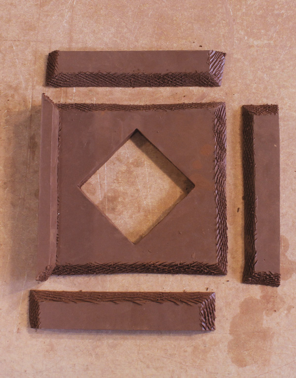 6 Score all beveled edges and begin to assemble walls around the frame face.