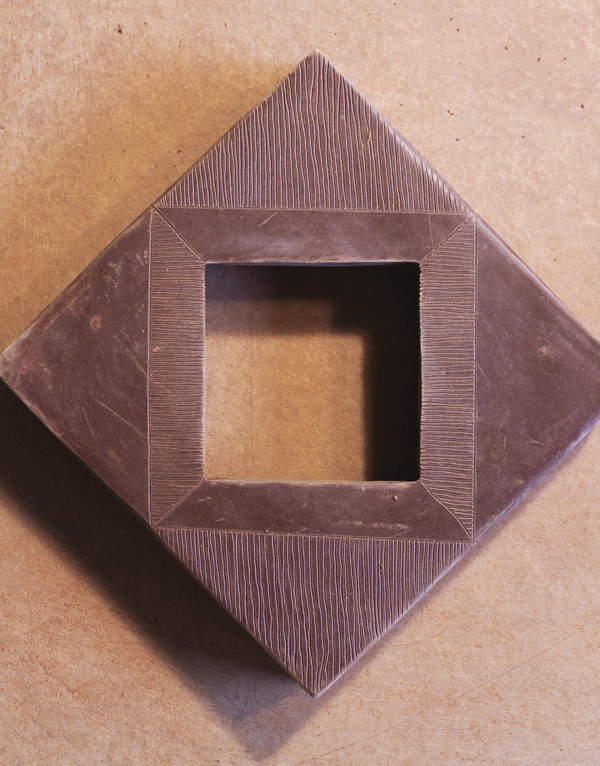14 When the frame is nearly bone dry, use a sharpened needle tool to draw design.