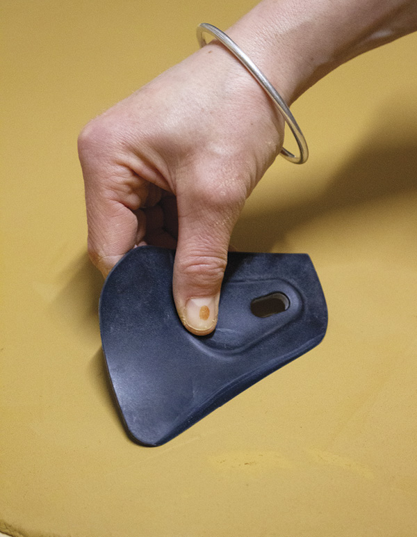 1 Rollout a thick slab and compress it with a rubber kidney rib.