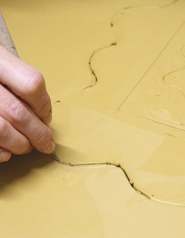 2 Sketch the size and shape of the mirror, then cut it out with a needle or a knife.