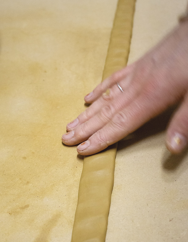 4 Gently flatten the coil so one edge is slightly thinner then the other.
