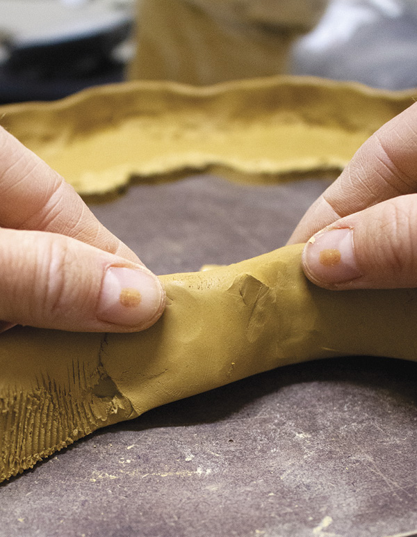 7 Smooth the surface again with your fingers to hide the serrated rib texture.