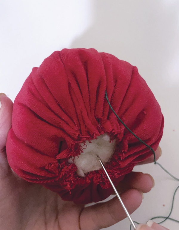 16 Run a stitch around the fabric edge, cinch it, stuff it, then close it up.