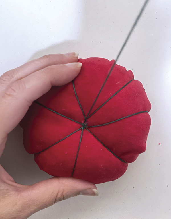 17 Send a threaded needle through the center, then create sections.