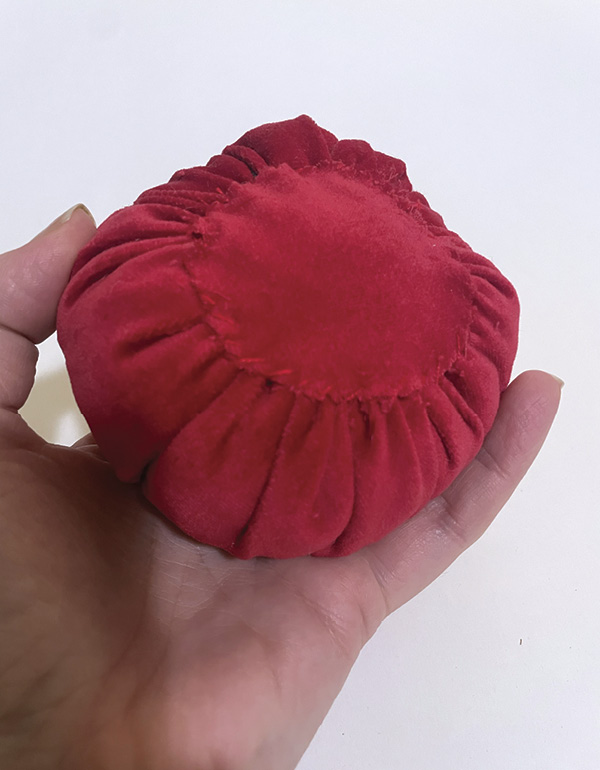 20 Cut out a piece of fabric and stitch to the bottom of cushion to cover the hole.
