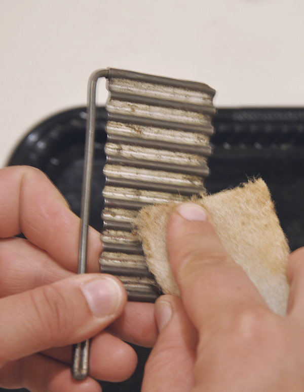 3 Scrub the surfaces with synthetic steel wool to remove stubborn residue.