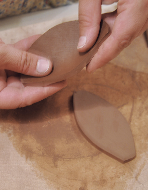 5 Push out on the inside of each pod-shaped slab to create volume.