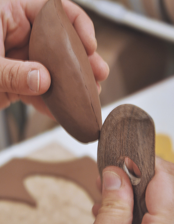 10 Press along the seam at the join with a wooden rib to define the line.