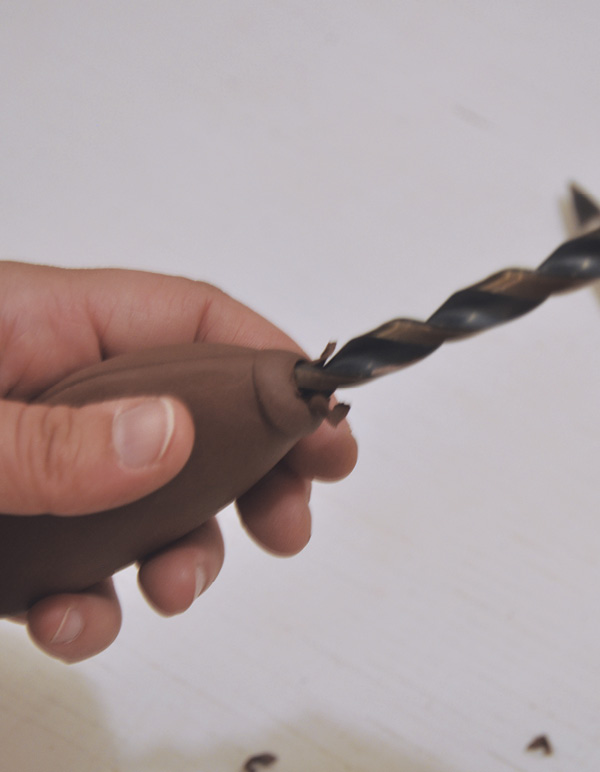 12 Create an opening in the leather-hard handle on the end using a drill bit.