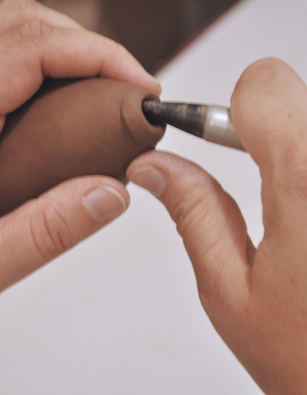 13 Compress and taper the edge of the hole with a soft rubber-tipped tool.