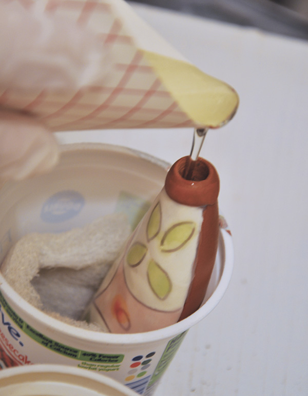 17 Prop up the handle and pour in casting resin until the handle is about ¾ full.