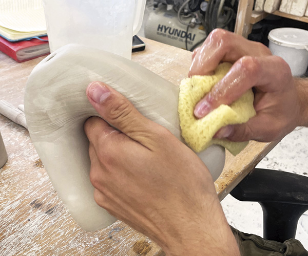 6 Remove the seams from the cast, then use a damp sponge to smooth the surface.