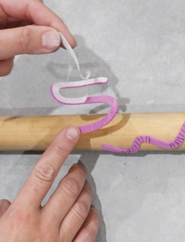 3 Peel off the craft foam backing and press the foam onto the dowel.