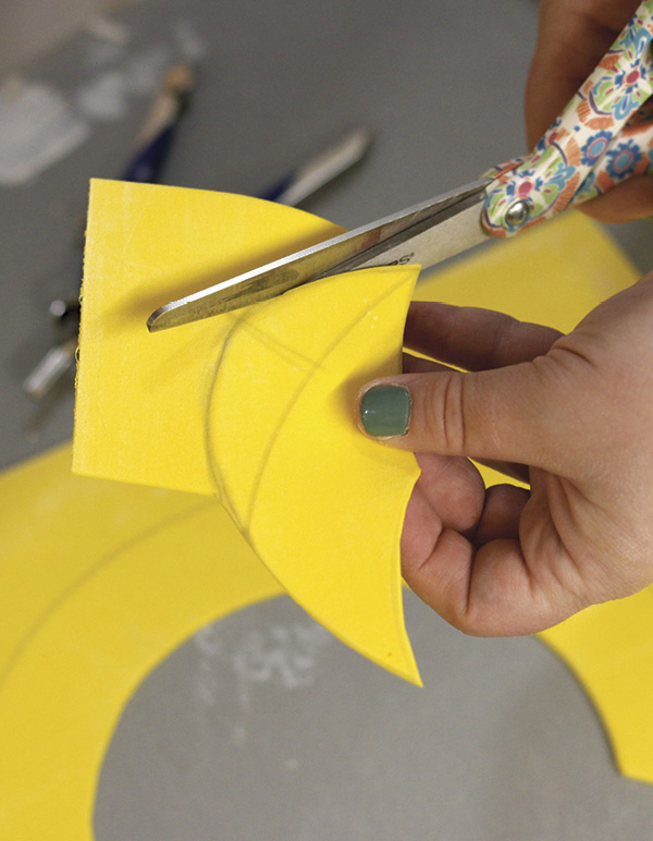 1 Draw and cut a scallop-shaped template from craft foam.