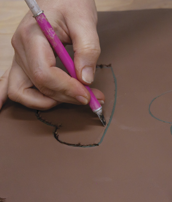 5 Cut out the shapes with a sharp blade, again slicing at 45º angle on the edge that will attach to the bowl.