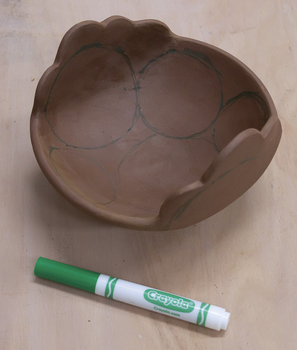 10 Plan the surface composition by making marks directly on the clay with a water-based marker.
