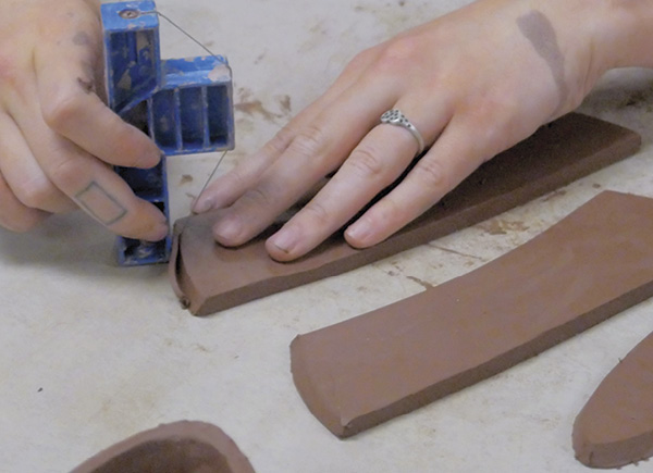 2 Use the 60° side of an angle tool to cut bevels into the slab sides  that will join to other slabs.