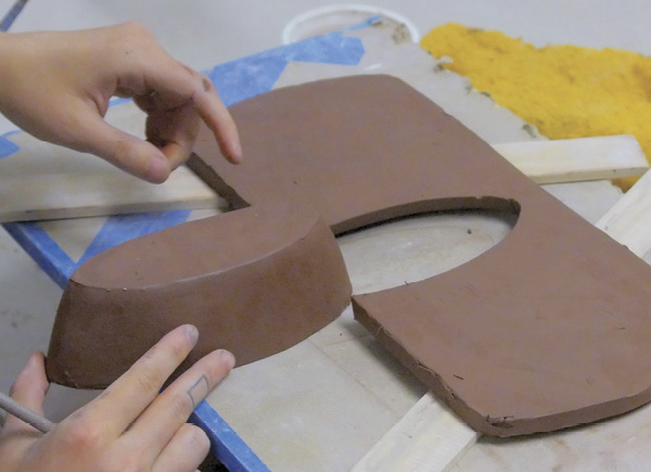 5 Trace the rim of the bowl onto a slab and cut it out. Slip, score, then slide the bowl into place. Repeat for the other two bowls.