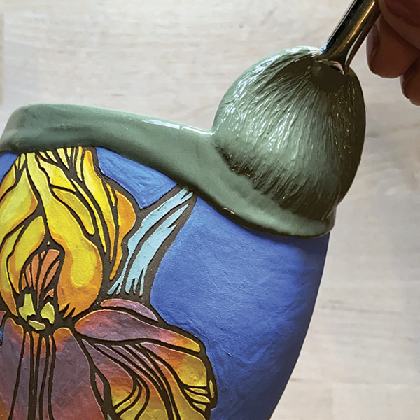 2 Ellen Duvall creates homemade vinyl stencils, which impart a graphic quality on her pots.